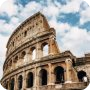 The Colosseum in Rome under a blue sky