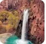 Waterfall cascading into a turquoise pool